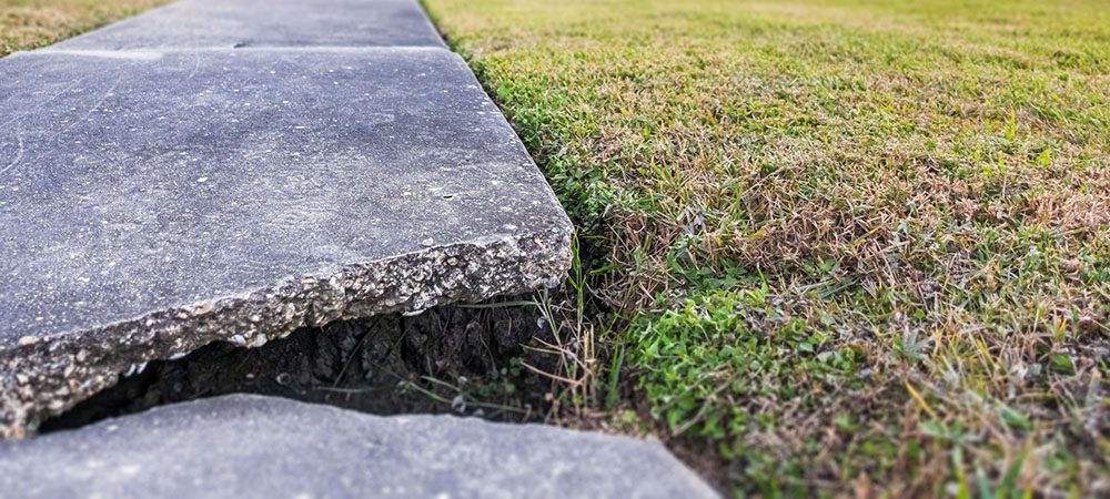 sidewalk uneven.